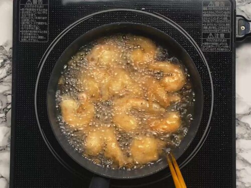 Prawns frying in a pan