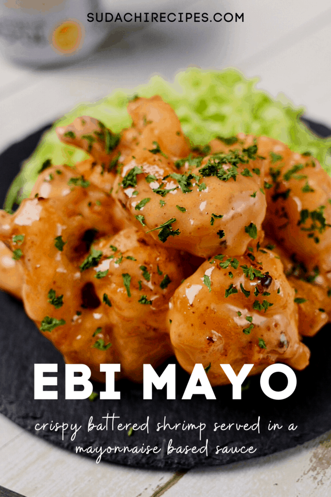 Ebi Mayo served on a black plate with shredded cabbage with text title