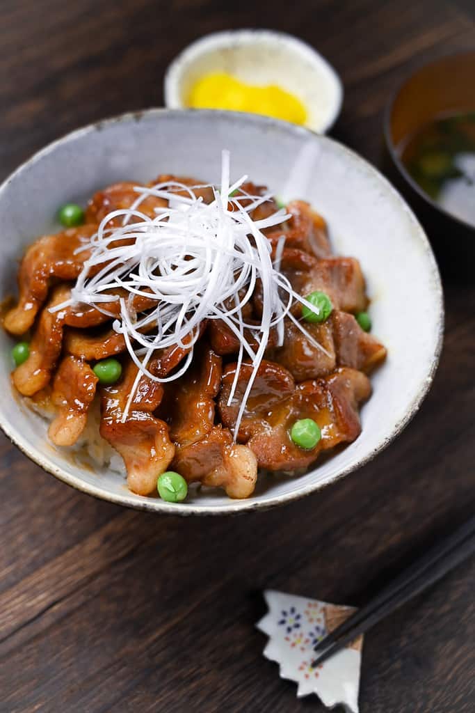 Butadon pork rice bowl served with takuan pickles and miso soup