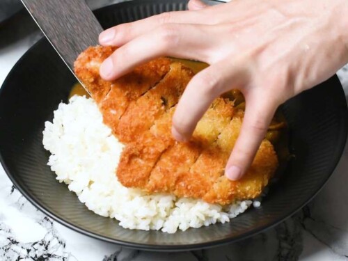 Place the katsu pieces through the middle of the curry rice