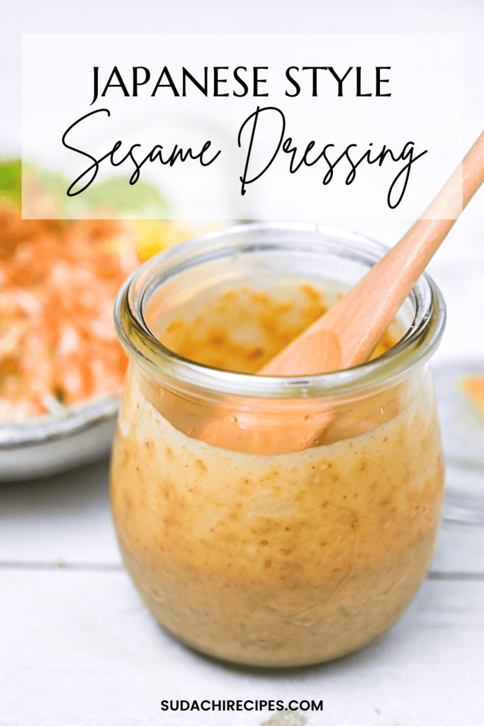 Japanese sesame dressing in a small jar with a wooden spoon