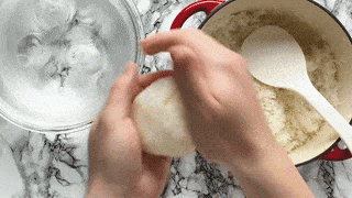 shaping a salted onigiri by hand