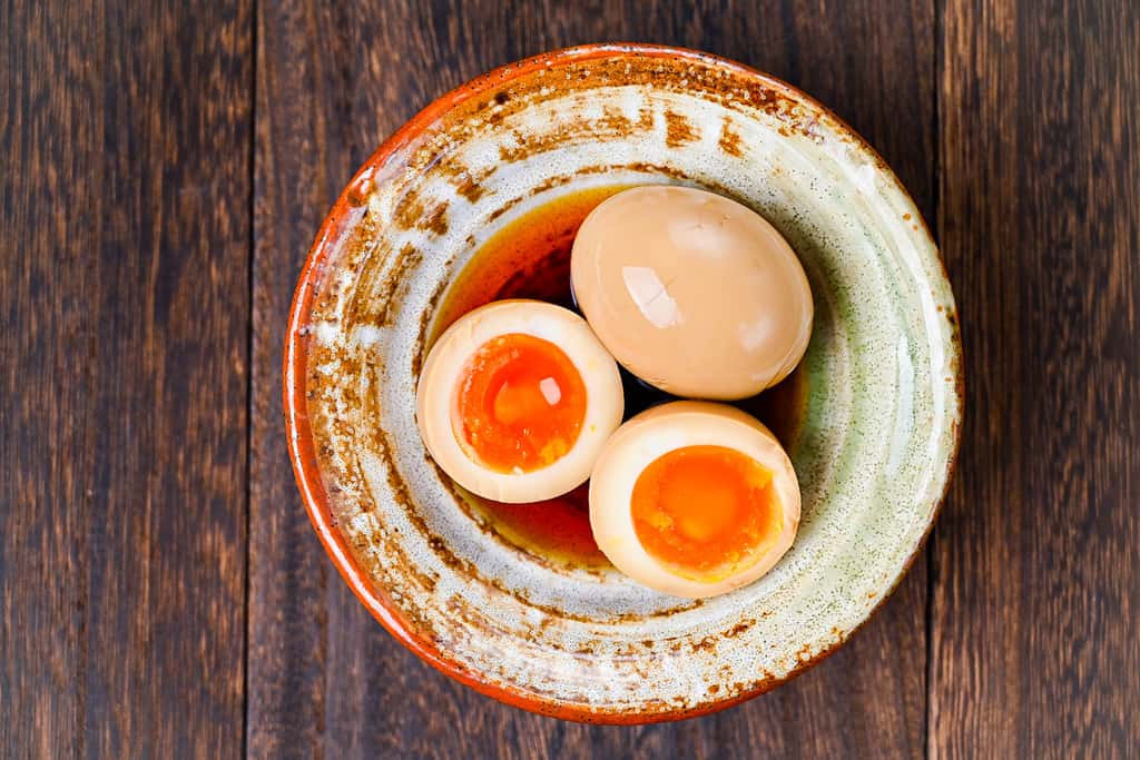 ramen eggs in a dish top down