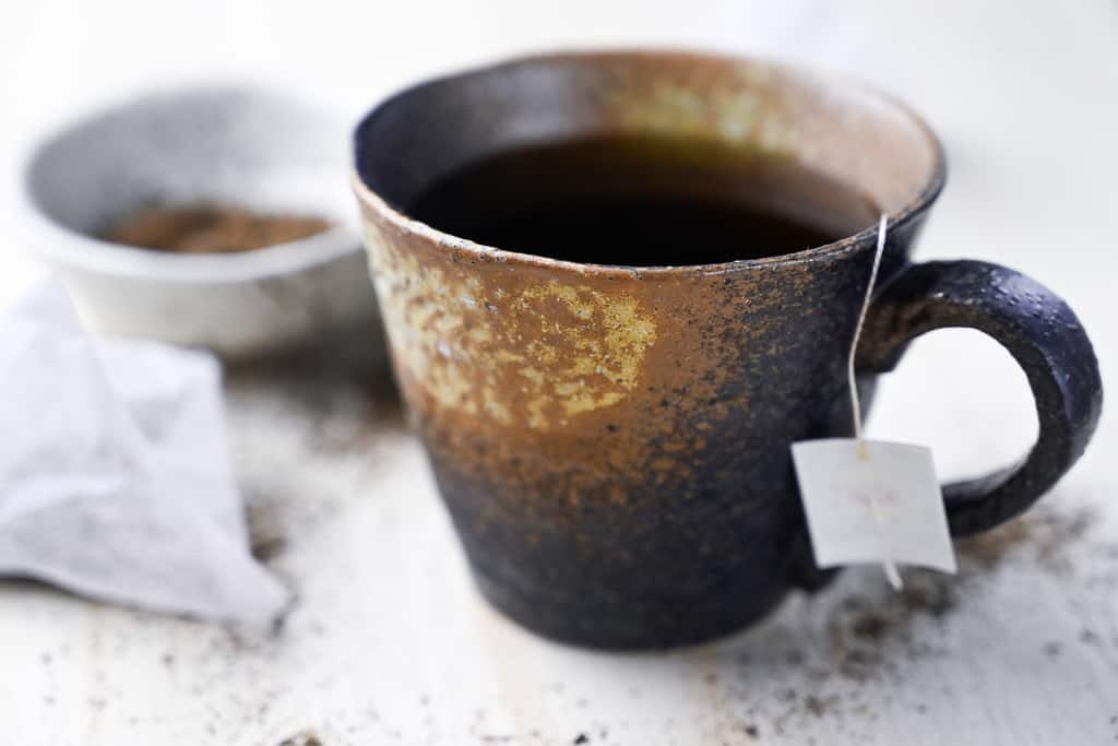a cup of hojicha tea with teabags