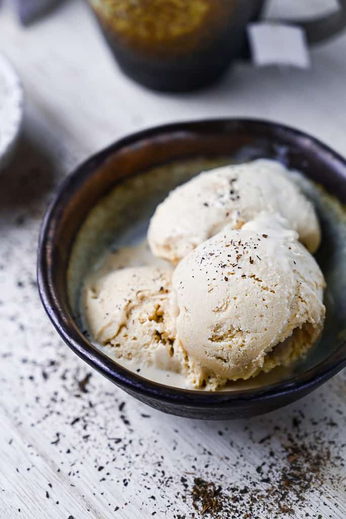 three scoops of hojicha ice cream in a brown bowl