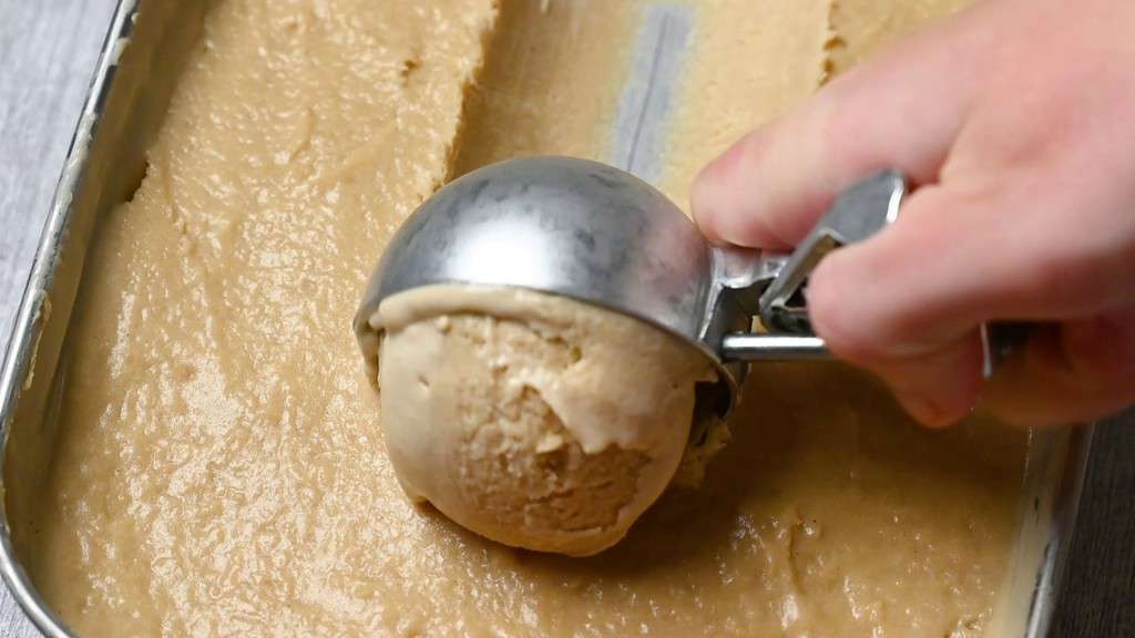 scooping hojicha ice cream with ice cream scoop