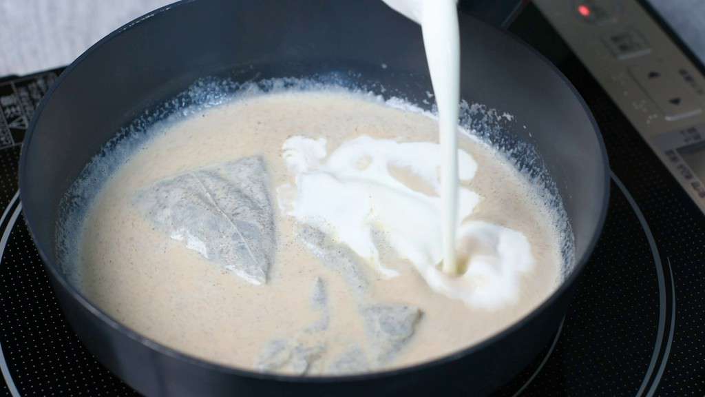 adding cream to the pan