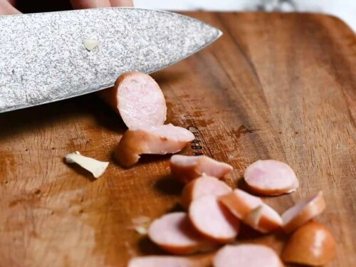 cutting hotdog sausages