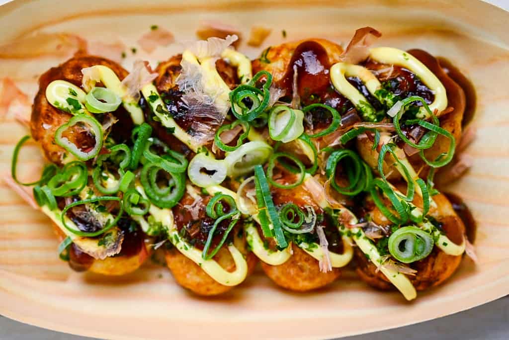 Takoyaki in a bamboo boat container top down view