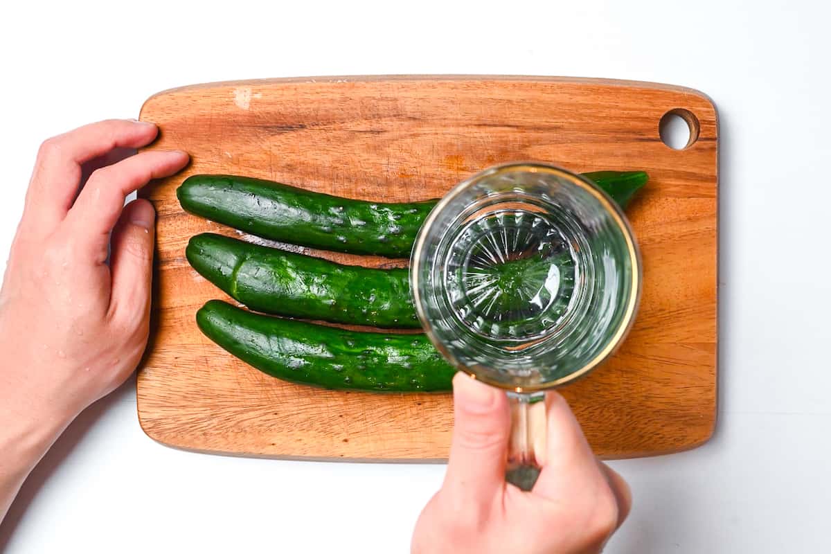 Crushing cucumber with heavy glass