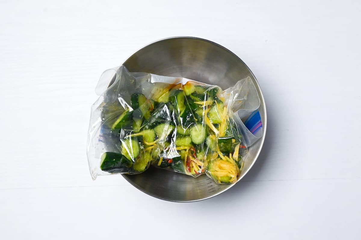 Storing ziplock bag of cucumber pickles in bowl