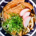 Kitsune udon in a blue bowl top down