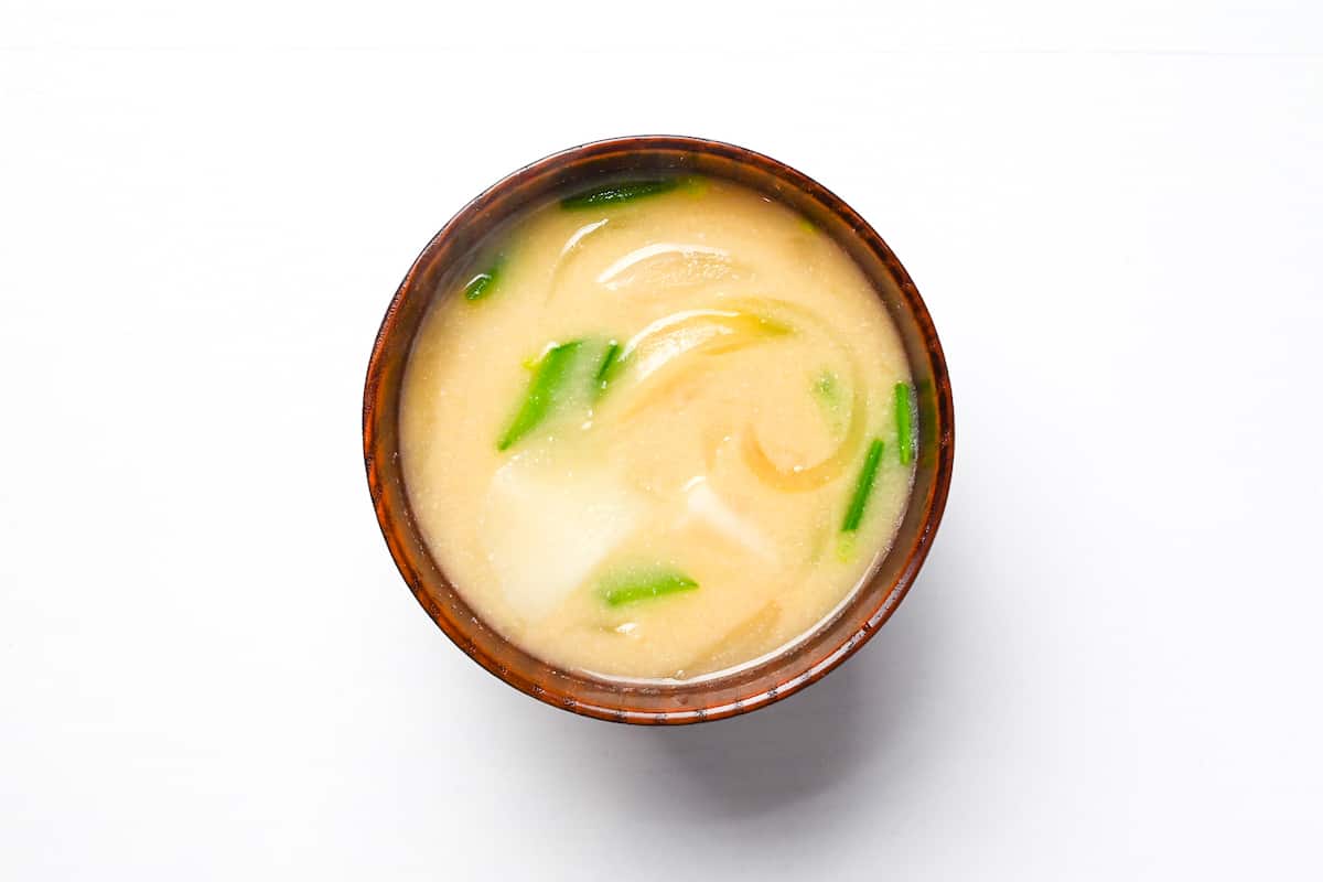 white miso soup with potato, onion and snow peas
