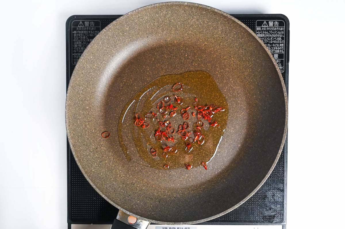 frying sliced chili in sesame oil