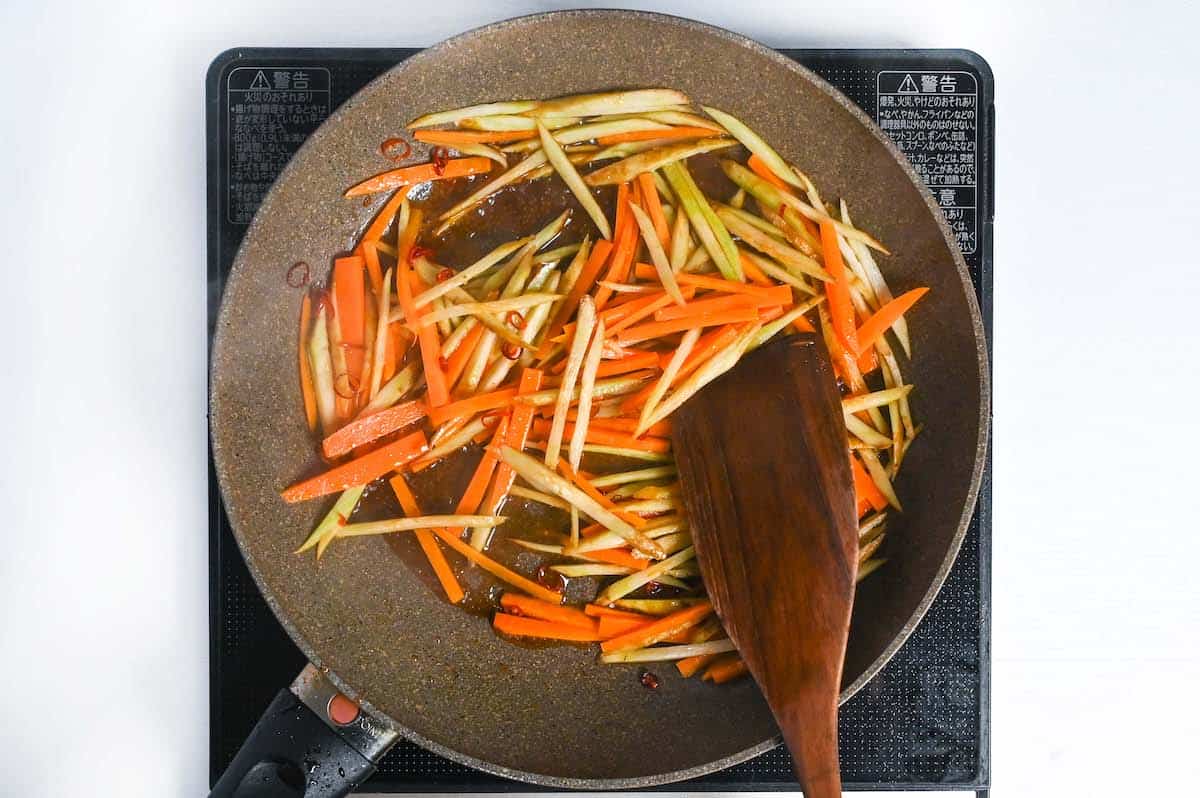 stir frying burdock root and carrot in kinpira gobo sauce