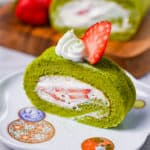 Matcha roll cake with fresh cream and strawberries