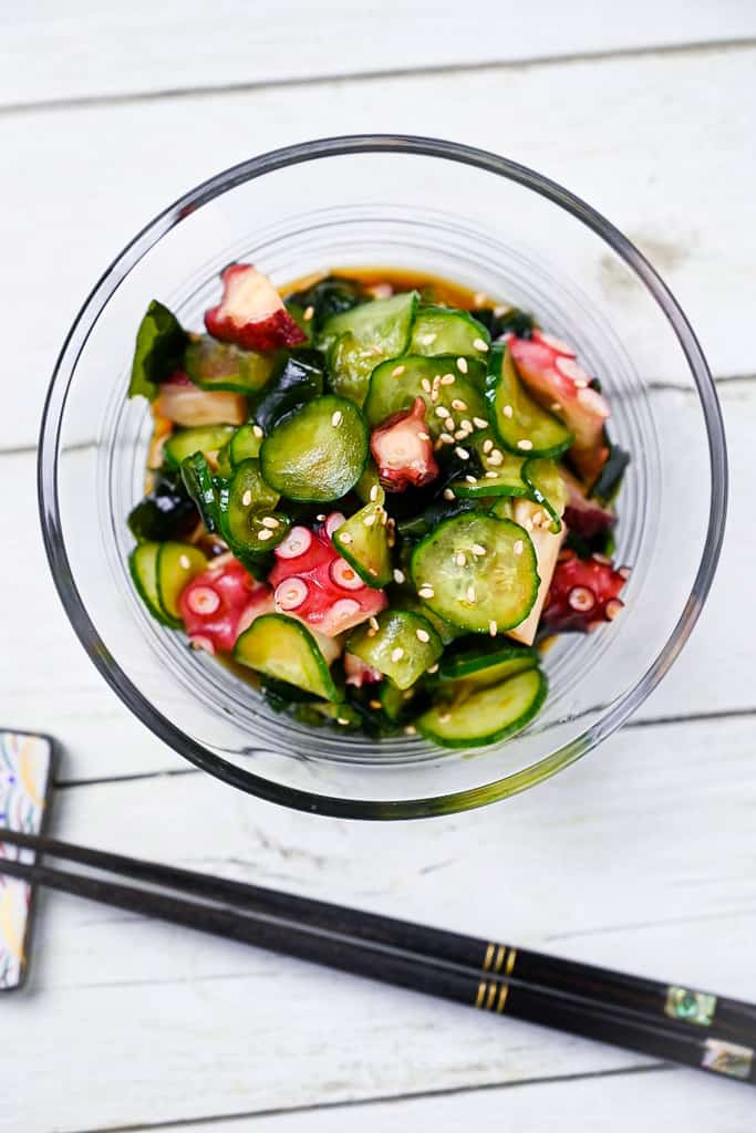 Japanese octopus and cucumber sunomono salad in a glass bowl top down