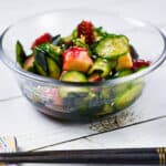 Japanese octopus and cucumber sunomono salad in a glass bowl side view
