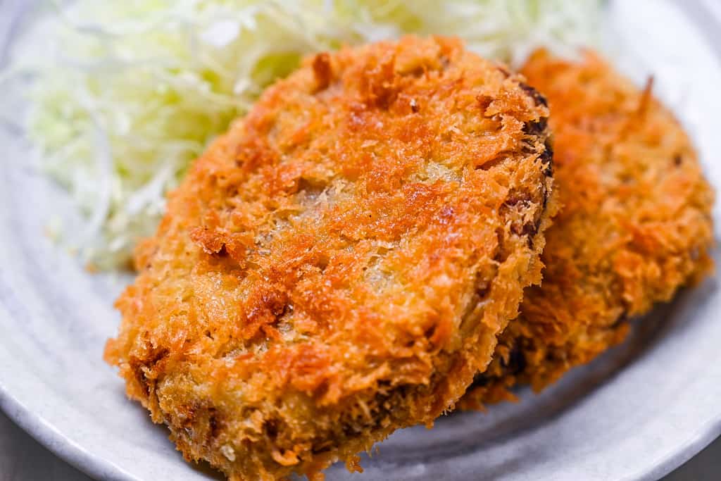 Japanese meat and potato korokke (croquette) served with shredded cabbage