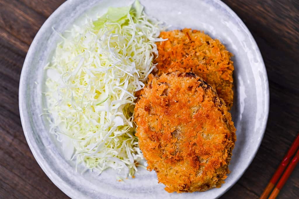 Japanese meat and potato korokke (croquette) served with shredded cabbage top down