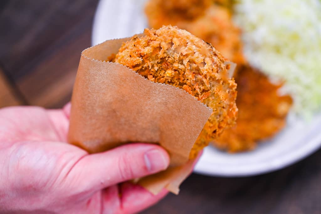 Butcher style Japanese meat and potato korokke in a paper bag