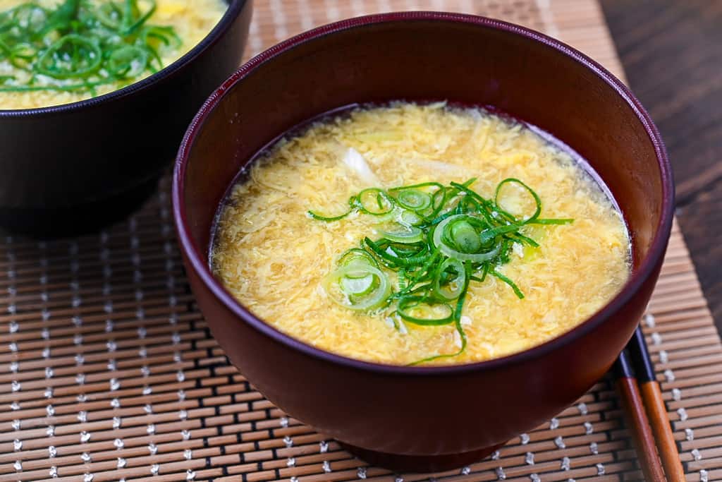 Japanese kakitamajiru egg drop soup topped with spring onions