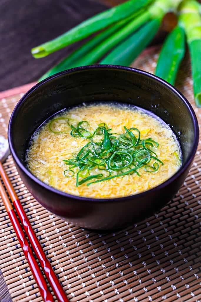 Japanese kakitamajiru egg drop soup topped with spring onions