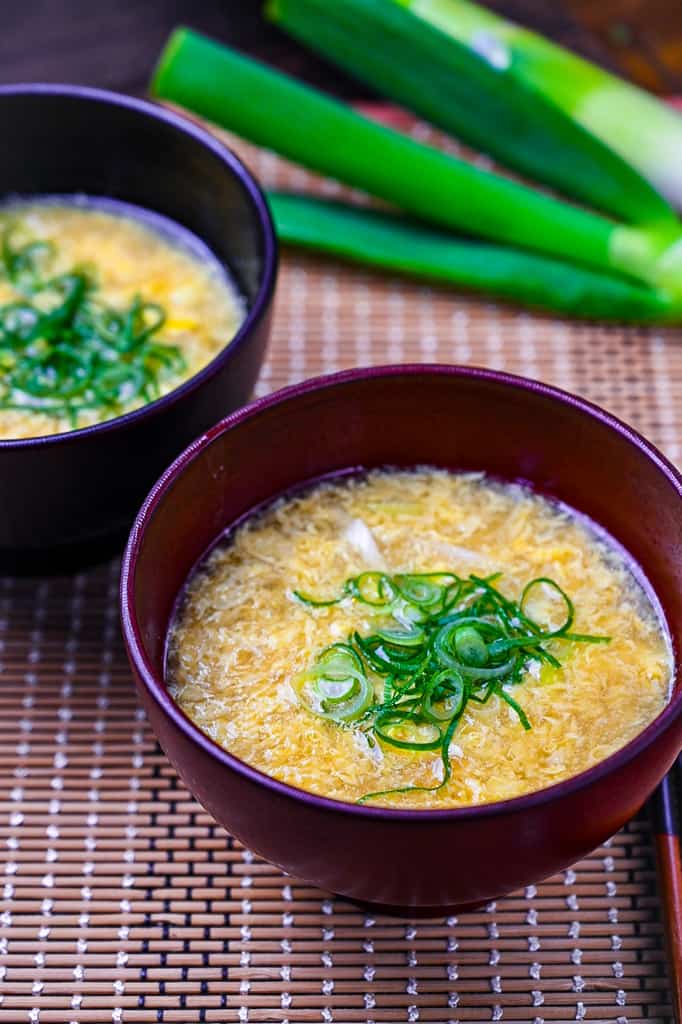 Japanese kakitamajiru egg drop soup topped with spring onions