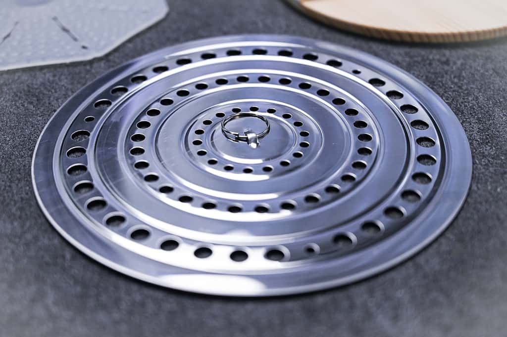 Steel otoshibuta drop lid on grey surface