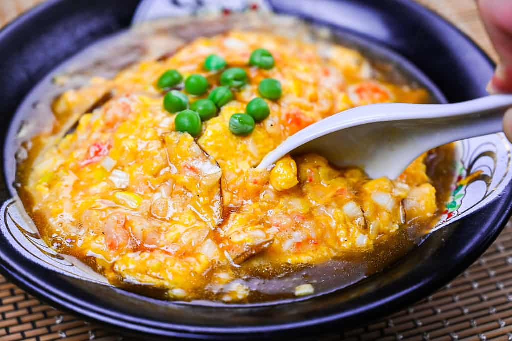 Tenshinhan - Crab meat omelette on rice with white spoon