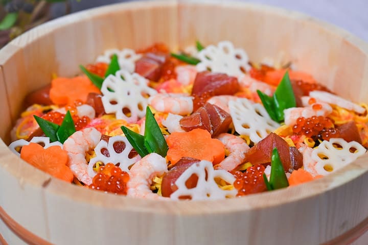 Chirashizushi scattered sushi bowl served in a wooden "sushi-oke"