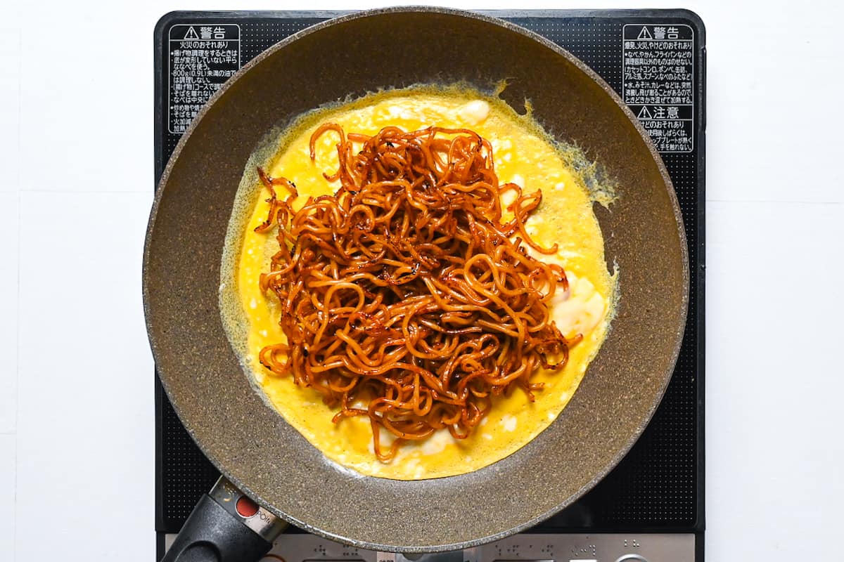 Yakisoba noodles on top of the egg
