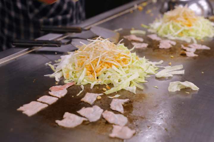 Hiroshima style okonomiyaki on a teppan