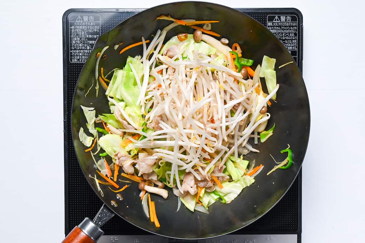 beansprouts added to the wok