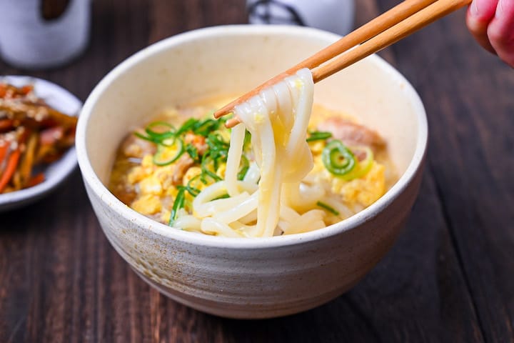 Oyako udon, udon noodles in a light dashi broth with chicken and egg