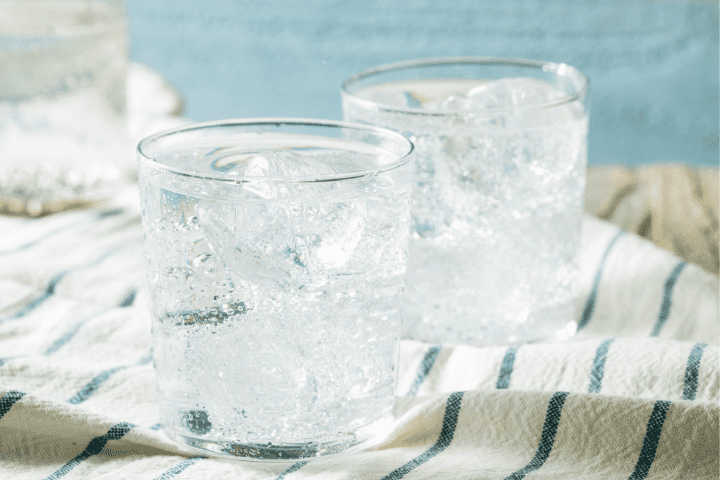 Sparkling water in two glasses with ice
