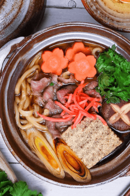 Beef Sukiyaki Nabe Udon in a brown pot