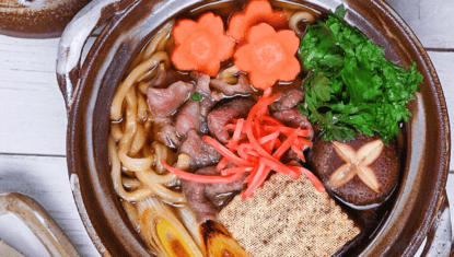 Beef Sukiyaki Nabe Udon in a brown pot