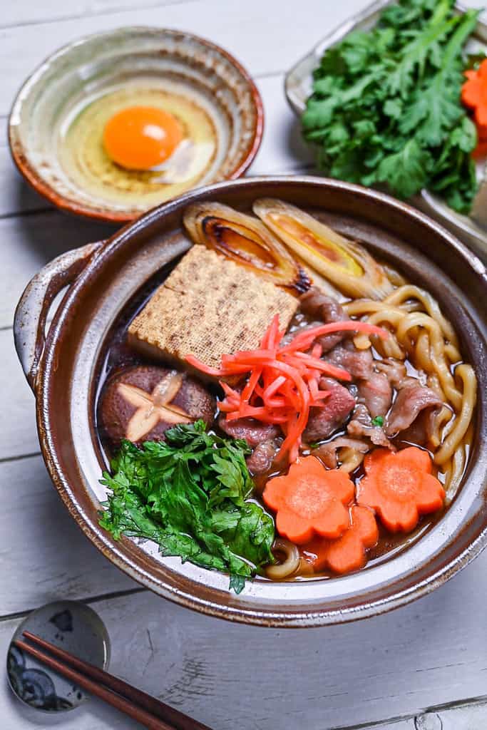 Sukiyaki nabe udon in a brown donabe