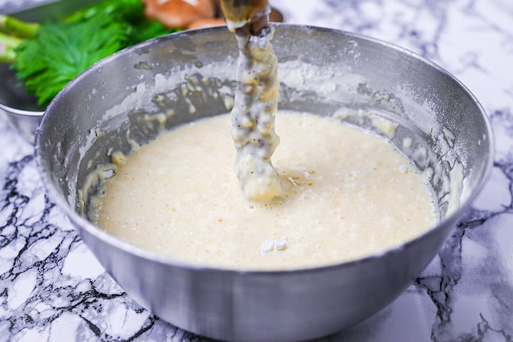 Tempura batter in a steel mixing bowl