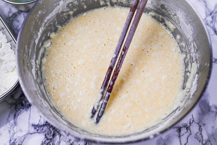 Tempura batter in a steel mixing bowl