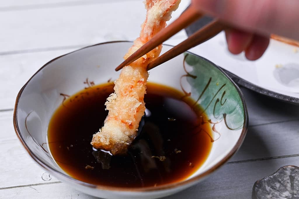 shrimp tempura dipped in tentsuyu dipping sauce