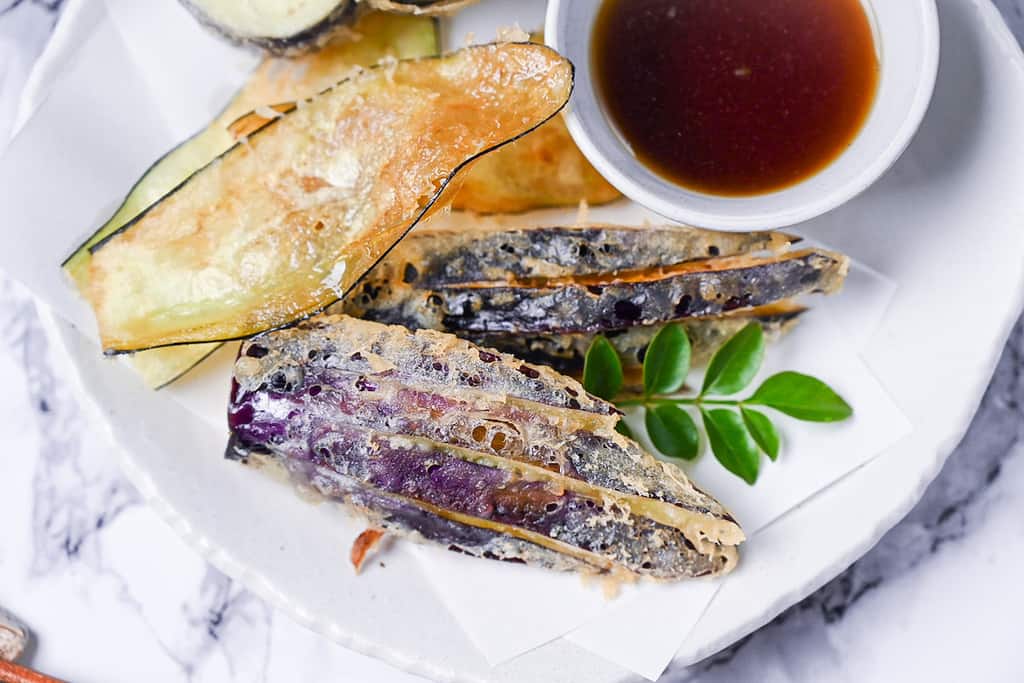 Eggplant cut into fan shapes and then deep fried in a tempura batter