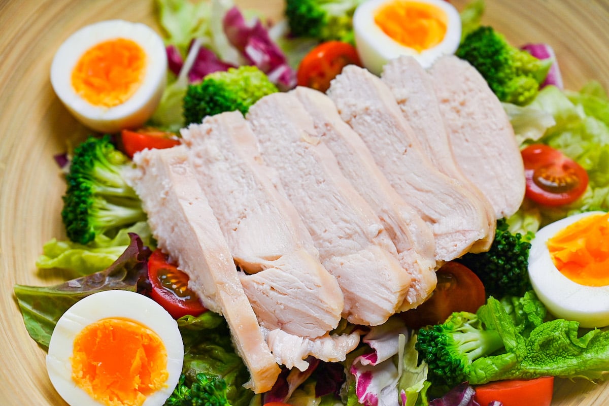 Japanese salad chicken with boiled eggs, brocolli and mixed leaf salad