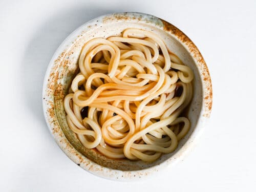 udon noodles in bukkake sauce in a bowl