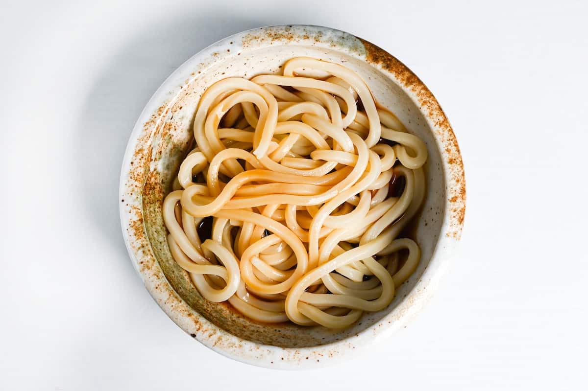 udon noodles in bukkake sauce in a bowl