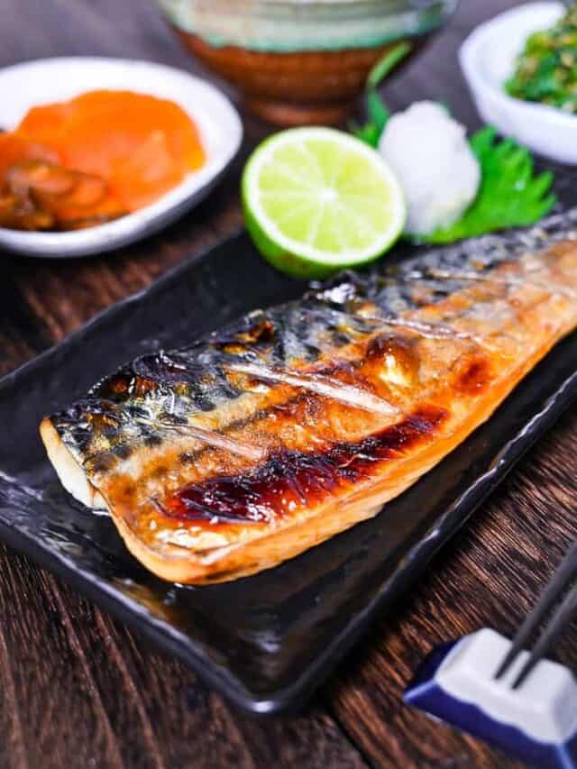 Japanese grilled mackerel (saba no shioyaki) served with oroshi daikon, sudachi, rice, miso soup and pickles