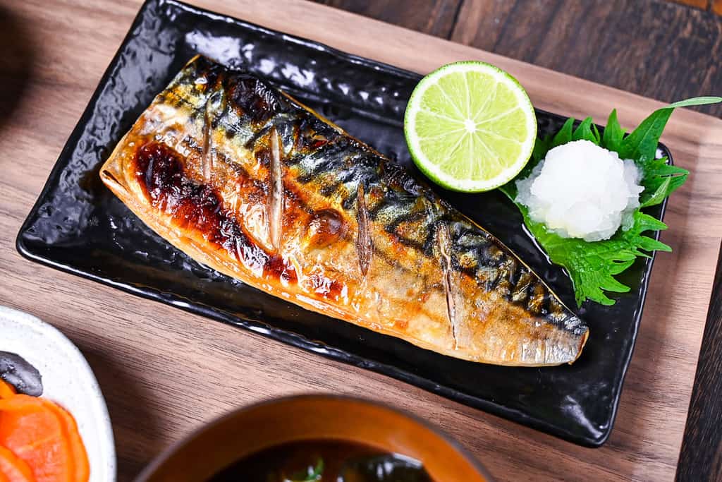 Japanese grilled mackerel (saba no shioyaki) served with oroshi daikon, sudachi, rice, miso soup and pickles