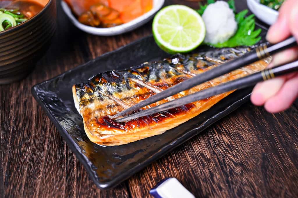 Japanese grilled mackerel (saba no shioyaki) served with oroshi daikon, sudachi, rice, miso soup and pickles