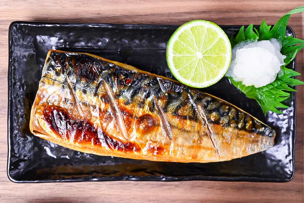 Japanese grilled mackerel (saba no shioyaki) served with oroshi daikon, sudachi, rice, miso soup and pickles